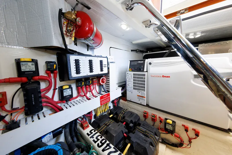 Slide: The Image of Engine room of 2013 Sabre 42 Salon Express with Cummins Onan generator and electrical components. - 45