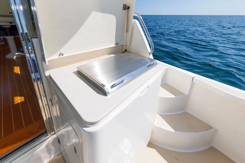 Slide: The Image of 2013 Sabre 42 Salon Express yacht deck with grill and ocean view. - 22