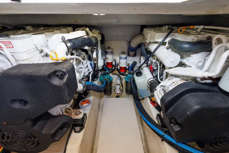Slide: The Image of Engine room of 2013 Sabre 42 Salon Express, showcasing dual engines and mechanical components. - 47