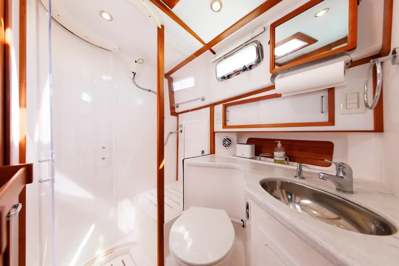 Slide: The Image of Luxurious bathroom interior of 2013 Sabre 42 Salon Express yacht, featuring modern fixtures and elegant design. - 40