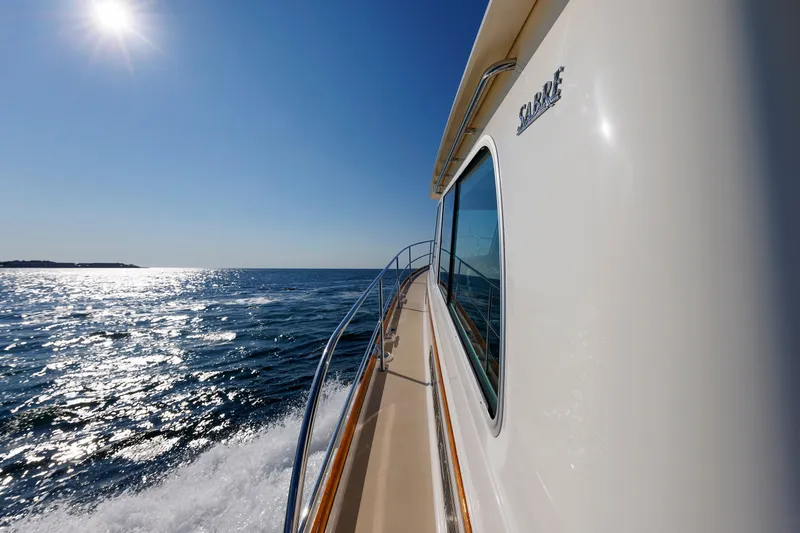 Slide: The Image of 2013 Sabre 42 Salon Express cruising on sunny ocean waters. - 11
