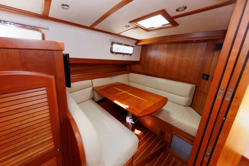 Slide: The Image of Luxurious interior of 2013 Sabre 42 Salon Express yacht with wooden finishes and cozy seating. - 37