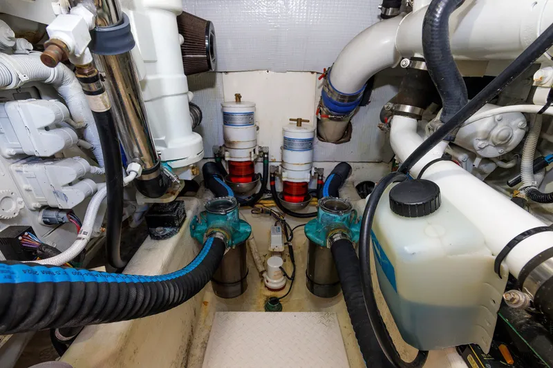 Slide: The Image of Engine room of 2013 Sabre 42 Salon Express, showcasing mechanical components and piping. - 51