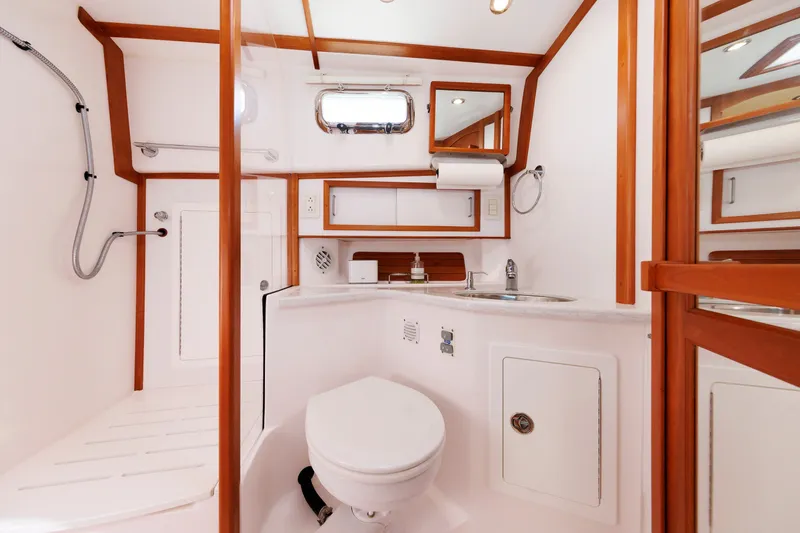 Slide: The Image of Luxurious bathroom in 2013 Sabre 42 Salon Express yacht, featuring modern fixtures and wood accents. - 39
