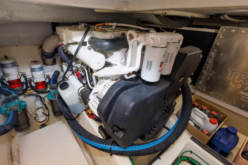 Slide: The Image of Engine room of 2013 Sabre 42 Salon Express, showcasing detailed mechanical components. - 49