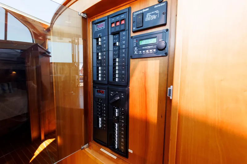 Slide: The Image of Electrical panel inside 2013 Sabre 42 Salon Express yacht, featuring control switches and displays. - 42