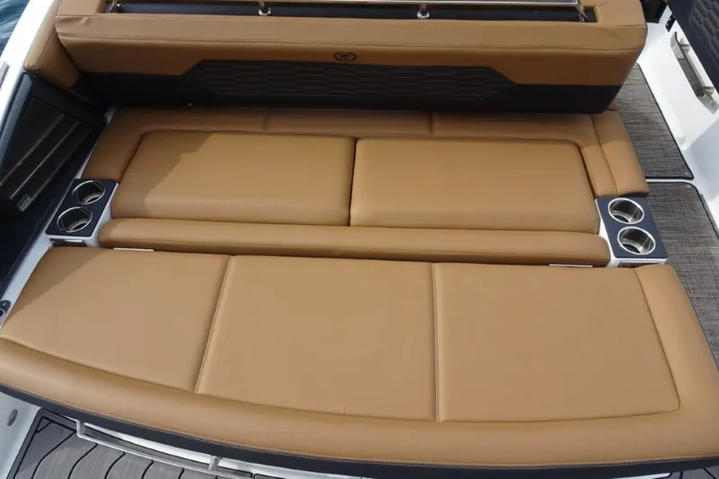 Slide: The Image of Luxury tan leather seating on 2022 Cobalt A29 boat with cup holders. - 9