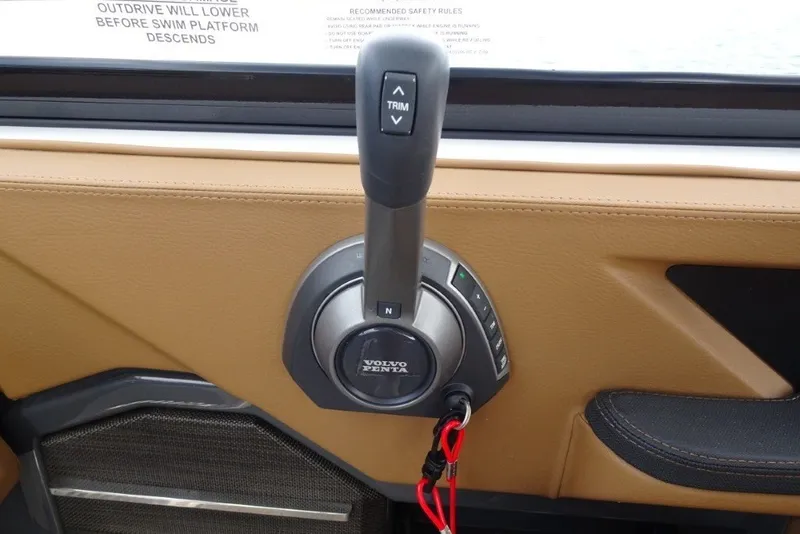 Slide: The Image of Throttle control lever in a 2022 Cobalt A29 boat interior. - 23