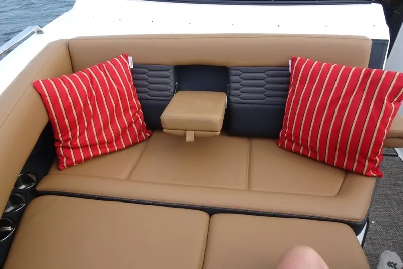 Slide: The Image of Luxurious seating area on 2022 Cobalt A29 boat with red striped cushions. - 31