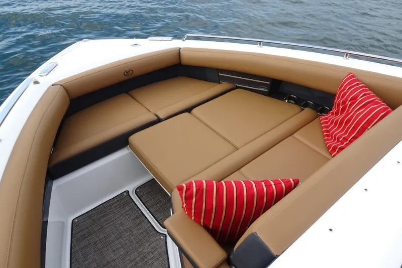 Slide: The Image of Luxurious seating area on 2022 Cobalt A29 boat with striped cushions. - 30