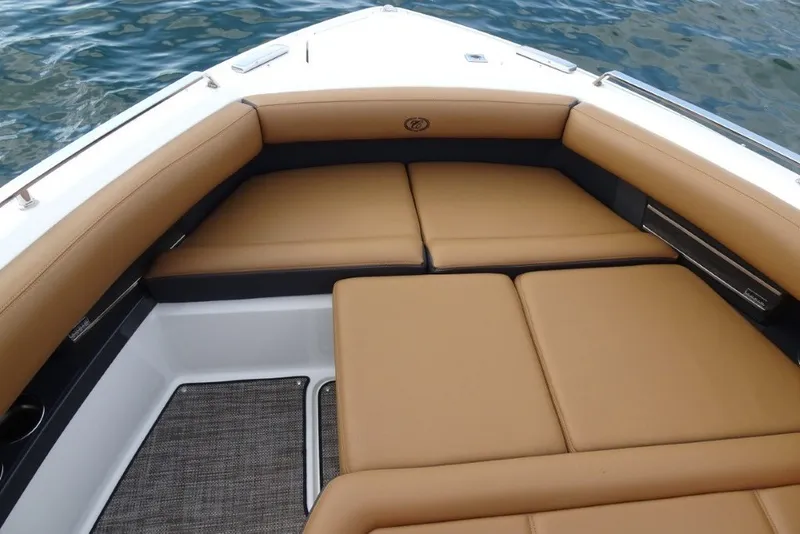 Slide: The Image of Luxurious tan seating on 2022 Cobalt A29 boat, with water in the background. - 29