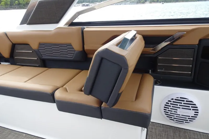 Slide: The Image of 2022 Cobalt A29 boat interior with tan and black seating, modern design. - 18