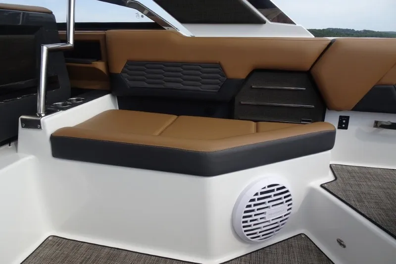 Slide: The Image of Luxurious interior seating of 2022 Cobalt A29 boat with brown and black upholstery. - 14