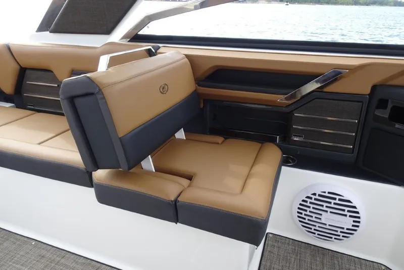 Slide: The Image of Luxurious interior seating of 2022 Cobalt A29 boat with tan and black upholstery. - 17