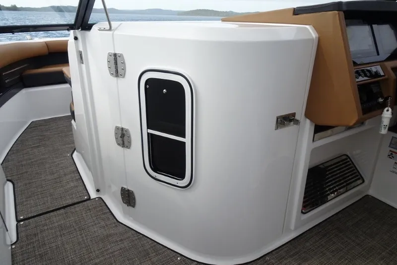 Slide: The Image of 2022 Cobalt A29 boat interior with sleek design and modern dashboard. - 25