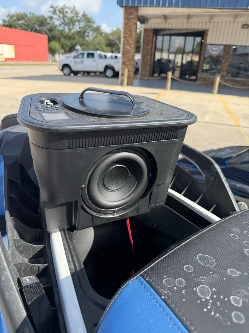 Slide: The Image of A speaker is mounted on a Yamaha WaveRunner parked in a lot. - 18