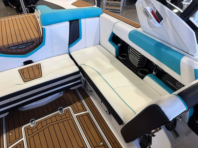 Slide: The Image of Interior of a 2017 Nautique Super Air Nautique G23 with white and blue upholstery. - 14