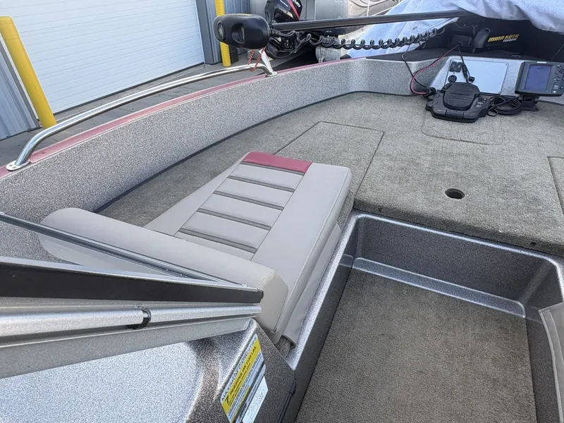 Slide: The Image of The image shows the deck of a 2014 Triton 192 Allure with a cushioned seat and fishing gear. - 8