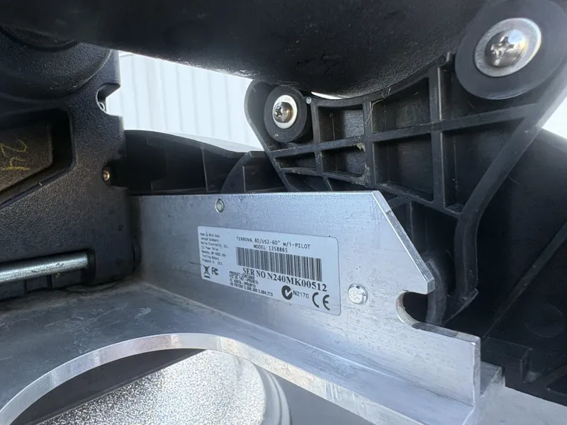 Slide: The Image of Close-up of a boat motor with serial number and technical details. - 27