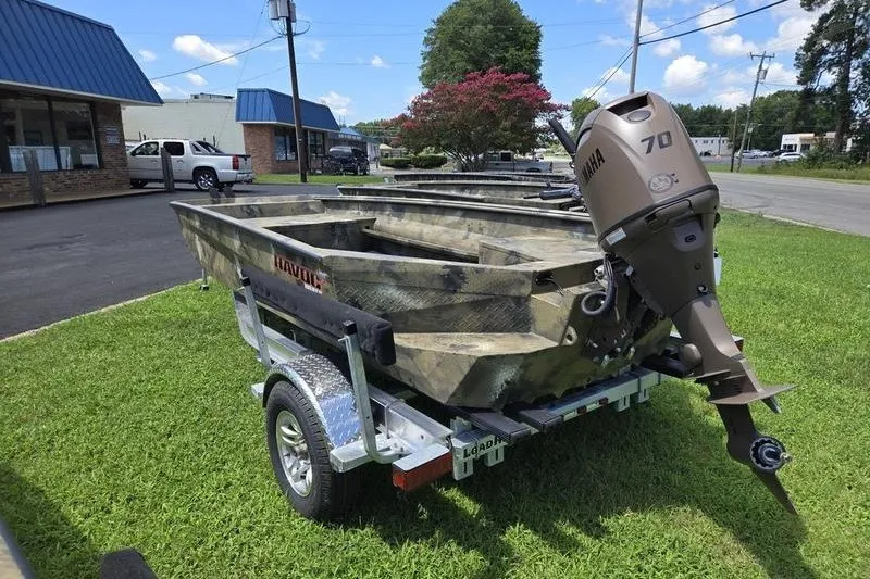 Slide: The Image of 2026 Havoc 1760 VJST boat with Yamaha 70 engine on trailer, parked on grass. - 9