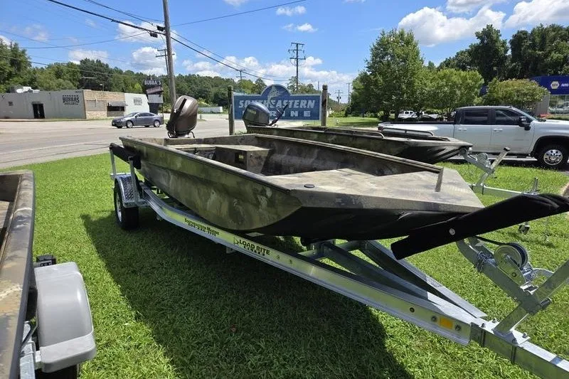 Slide: The Image of 2026 Havoc 1760 VJST boat on trailer, parked on grass under a clear blue sky. - 3