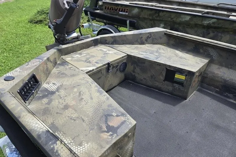 Slide: The Image of Camouflage-patterned 2026 Havoc 1760 VJST boat interior with motor and storage compartments. - 10