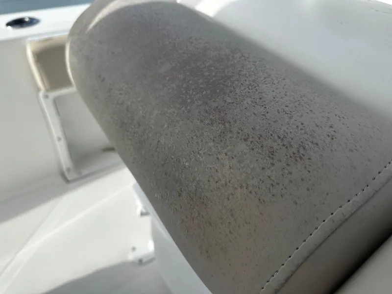 Slide: The Image of Close-up of a 2016 NauticStar 22 XS Offshore boat seat with textured upholstery. - 23
