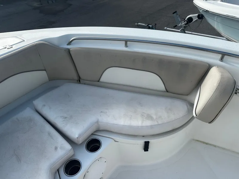 Slide: The Image of 2016 NauticStar 22 XS Offshore boat seating area with cup holders. - 42
