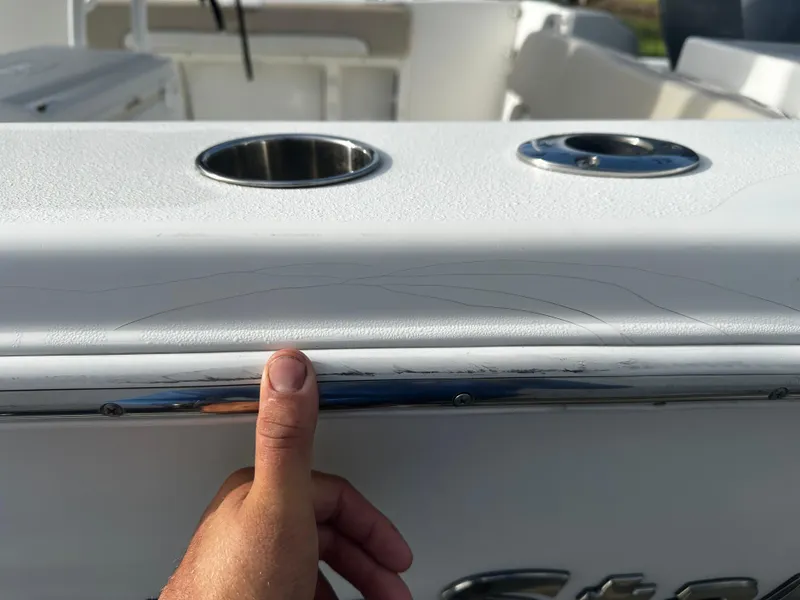 Slide: The Image of Close-up of 2016 NauticStar 22 XS Offshore boat detail with cup holders. - 11