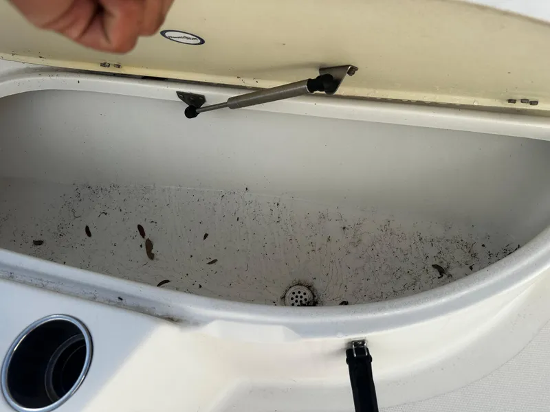 Slide: The Image of Open storage compartment on 2016 NauticStar 22 XS Offshore boat. - 48