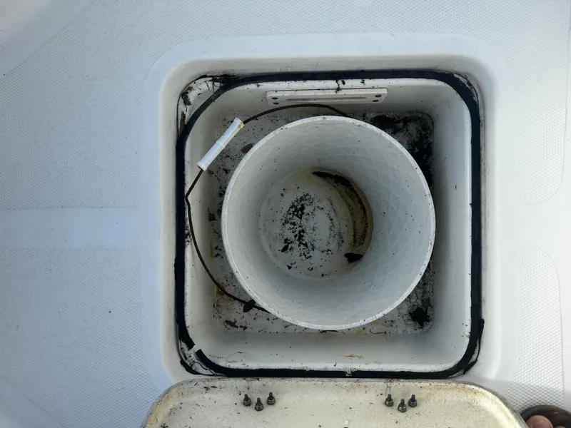 Slide: The Image of 2016 NauticStar 22 XS Offshore boat storage compartment with open lid. - 41