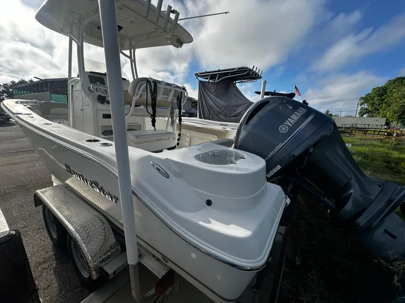 Slide: The Image of 2016 NauticStar 22 XS Offshore boat with Yamaha outboard engine on trailer. - 2