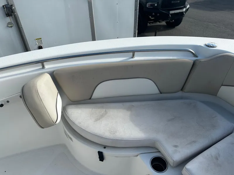 Slide: The Image of 2016 NauticStar 22 XS Offshore boat interior seating area with cushioned seats. - 45