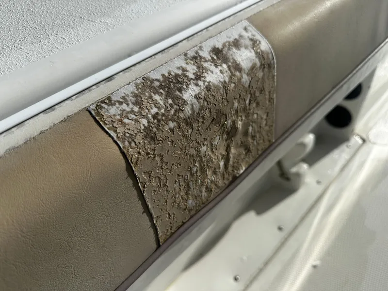 Slide: The Image of Damaged upholstery on 2016 NauticStar 22 XS Offshore boat seat. - 20