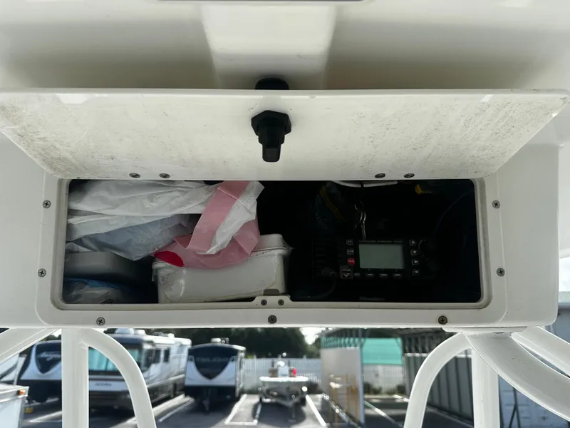 Slide: The Image of Storage compartment of 2016 NauticStar 22 XS Offshore boat, containing various items and equipment. - 27