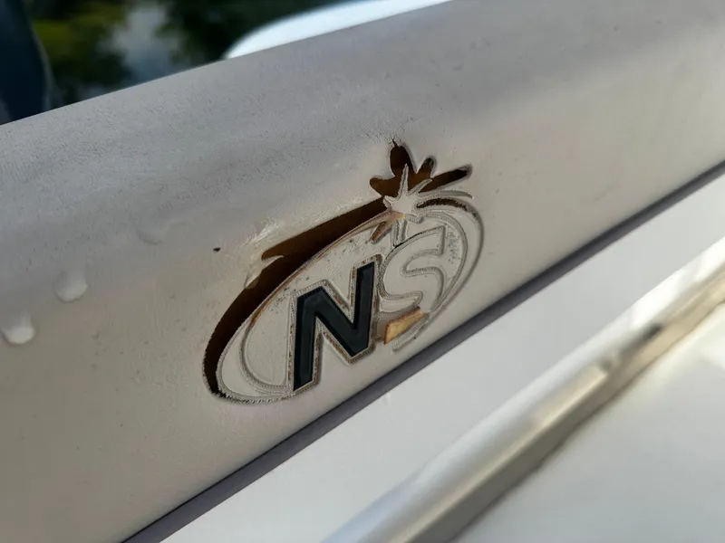 Slide: The Image of NauticStar 22 XS Offshore 2016 logo on boat surface. - 16