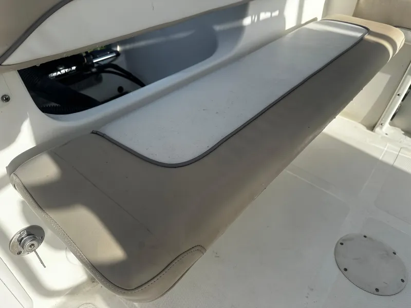 Slide: The Image of 2016 NauticStar 22 XS Offshore boat seat and storage compartment. - 17