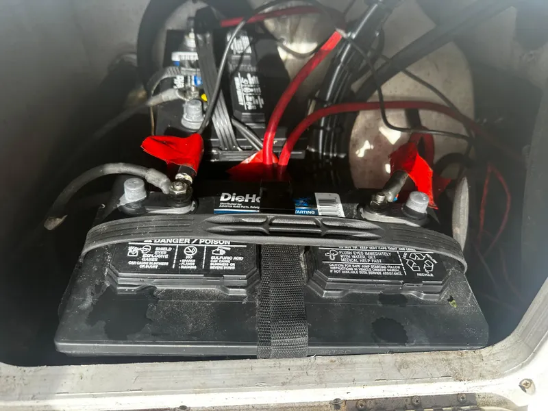 Slide: The Image of Battery compartment of 2016 NauticStar 22 XS Offshore boat with DieHard batteries. - 15