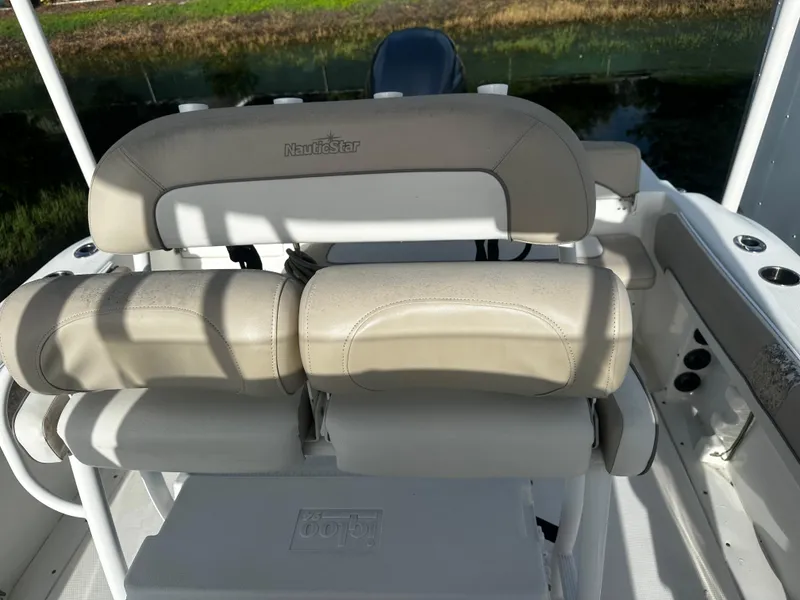 Slide: The Image of 2016 NauticStar 22 XS Offshore boat seating with beige upholstery. - 21