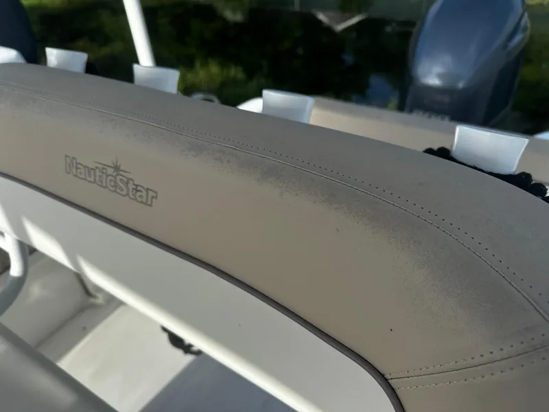 Slide: The Image of Close-up of 2016 NauticStar 22 XS Offshore boat seat with logo. - 24