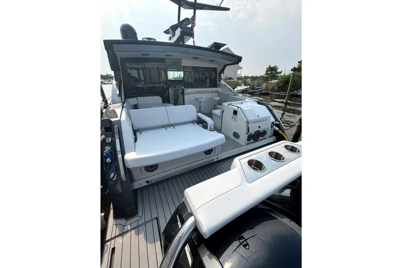 Slide: The Image of 2025 Formula 500 Super Sport Crossover boat with luxurious seating and sleek design. - 18