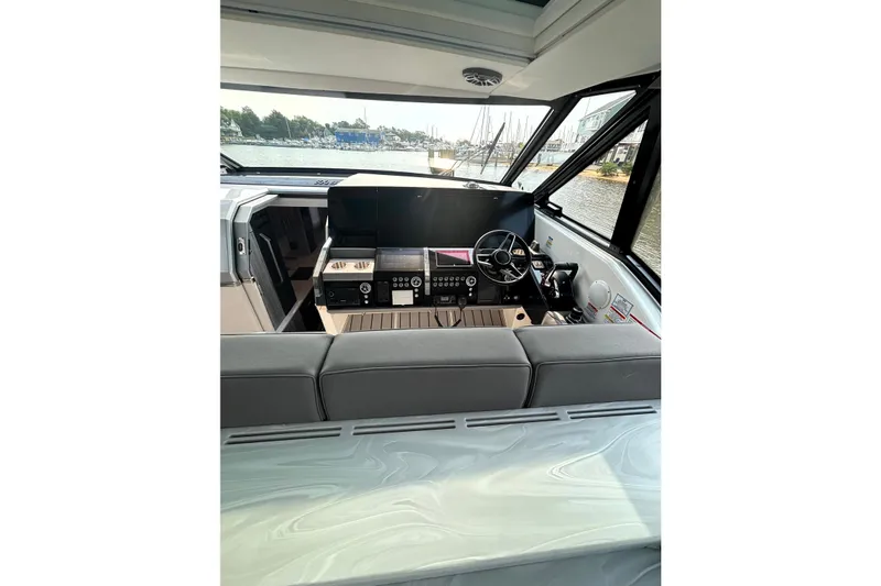Slide: The Image of Interior view of 2025 Formula 500 Super Sport Crossover yacht cockpit with modern controls. - 25