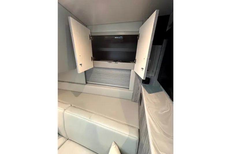 Slide: The Image of Interior of 2025 Formula 500 Super Sport Crossover with open storage cabinets. - 31