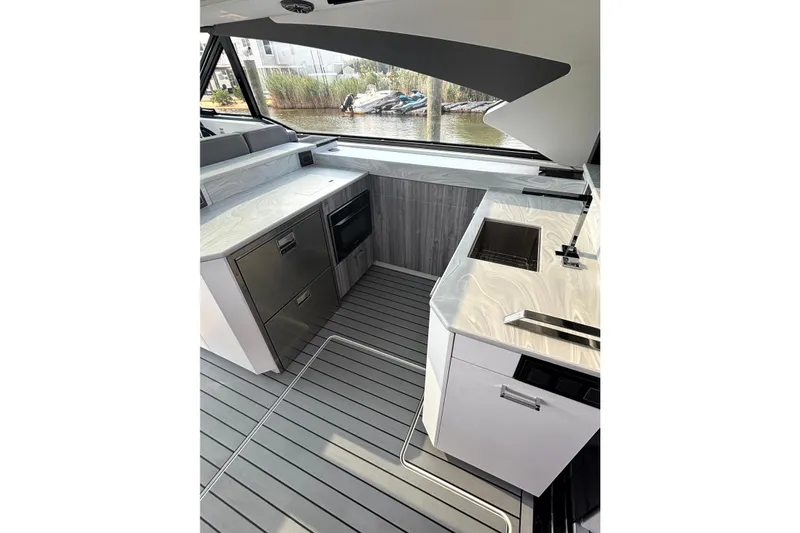 Slide: The Image of Modern kitchen area in 2025 Formula 500 Super Sport Crossover yacht, featuring sleek countertops and appliances. - 22