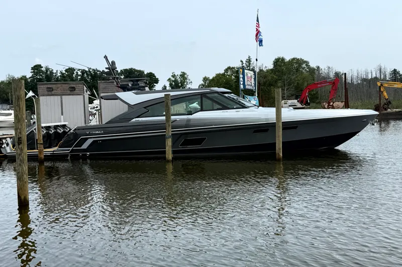 The Image of 2025 Formula 500 Super Sport Crossover boat docked on calm water. - 1