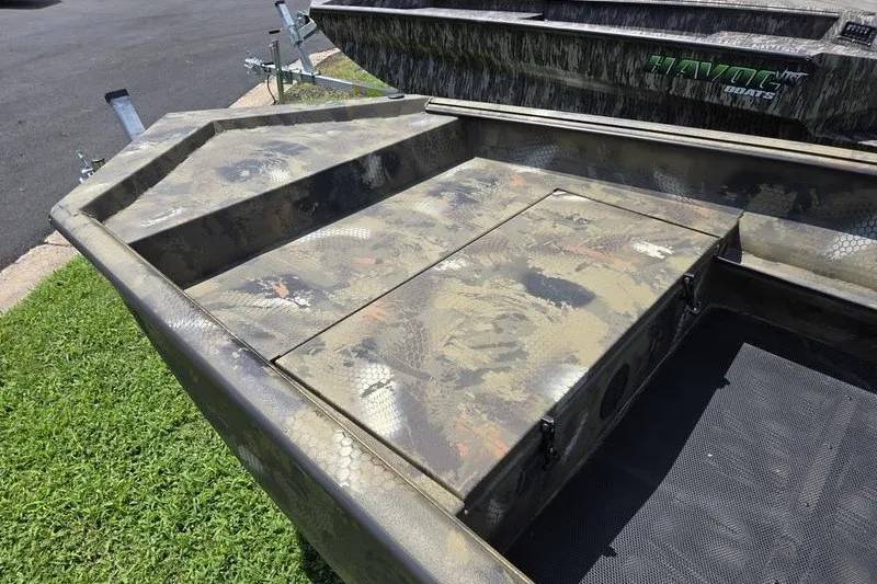 Slide: The Image of Camouflage-patterned 2026 Havoc 1553 VJST boat interior, featuring a sturdy storage compartment. - 12