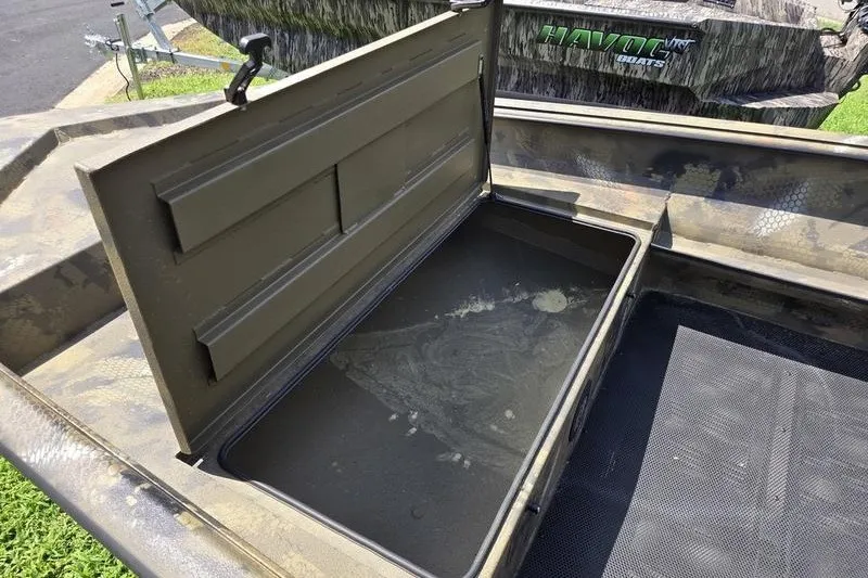 Slide: The Image of Open storage compartment in a 2026 Havoc 1553 VJST boat, showcasing interior space. - 13