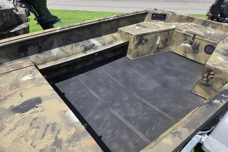 Slide: The Image of Camouflage interior of 2026 Havoc 1553 VJST boat with seating and storage compartments. - 11