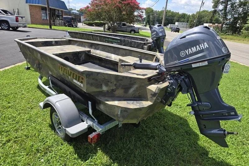 Slide: The Image of 2026 Havoc 1553 VJST boat with Yamaha motor on trailer, parked on grass. - 6