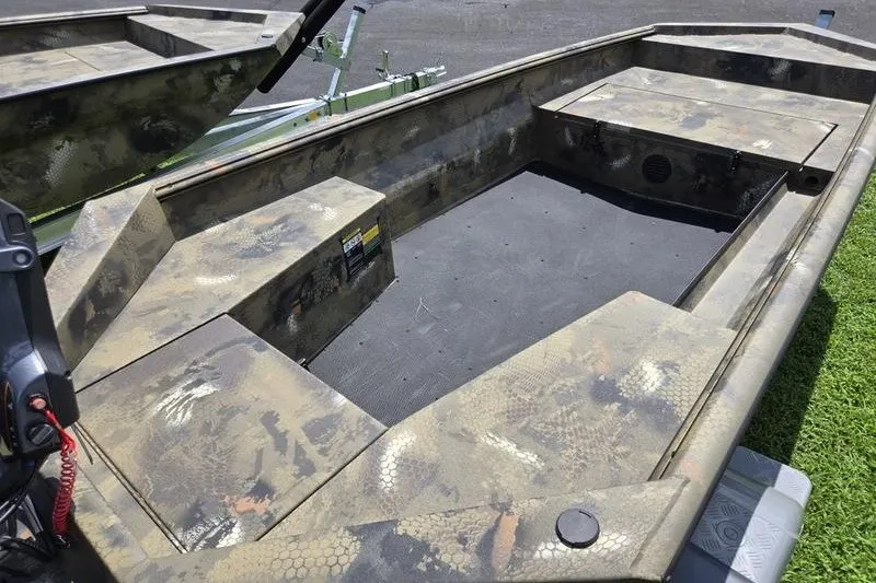 Slide: The Image of 2026 Havoc 1553 VJST boat interior with camouflage design and spacious seating. - 14